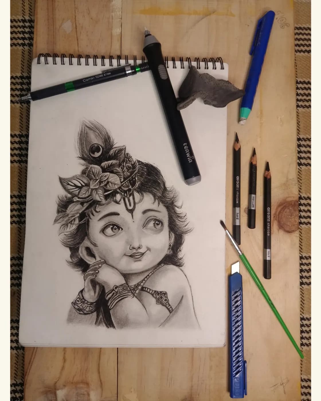 Handmade baby Krishna charcoal portrait, photo 1 of 3