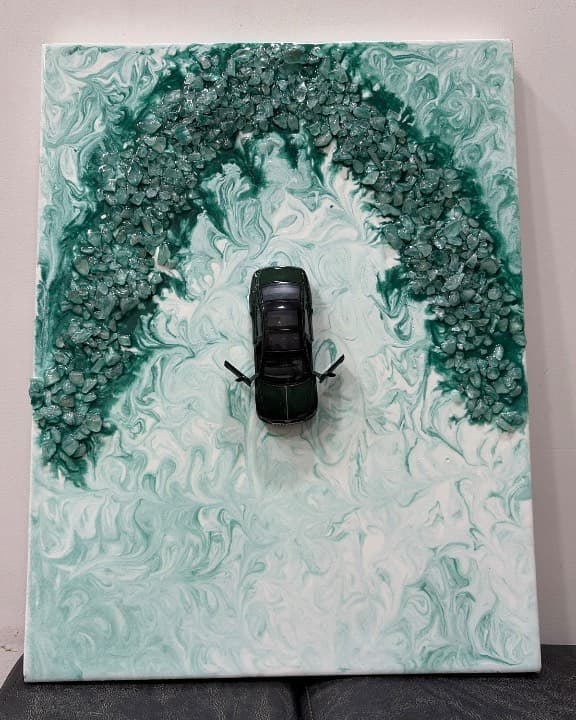 Green resin artwork with Bentley car