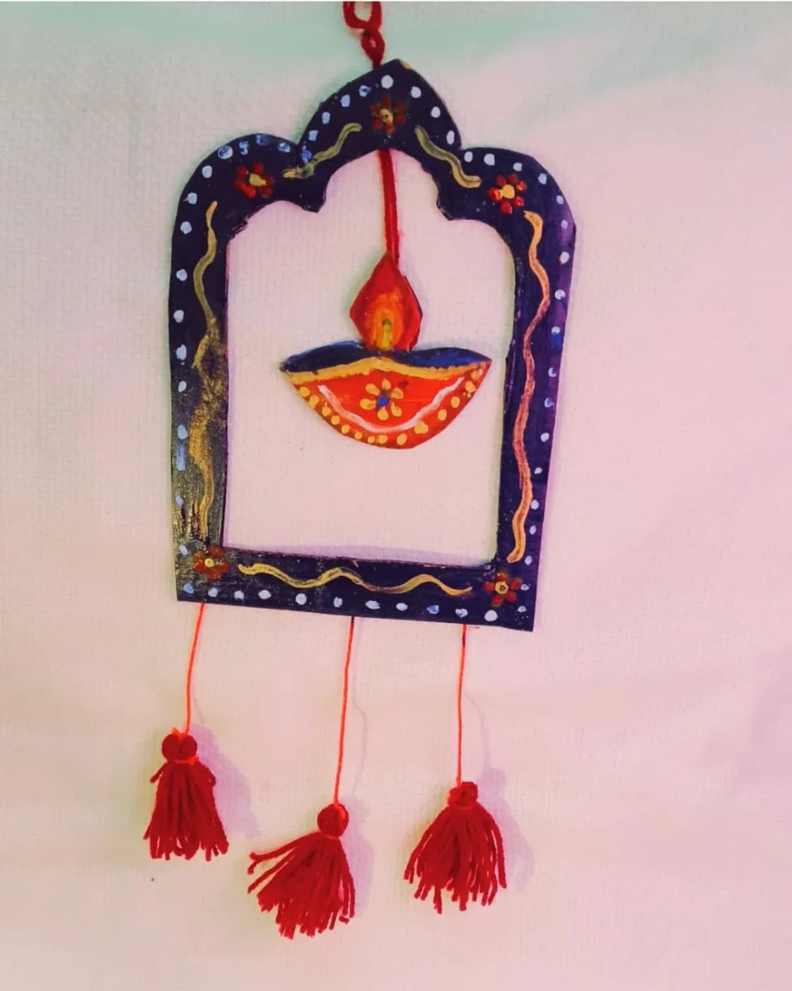 Handmade festive wall decor with diya, photo 1 of 2
